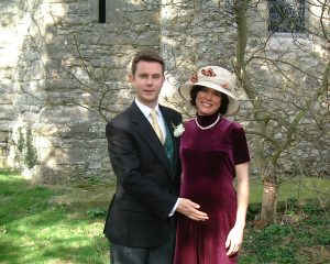 The happy parents-to-be at a typical English wedding, with Katy admittedly "thankful that my hat took a little of the focus off my belly." 